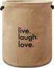 A close-up of a round, beige fabric laundry basket with black text that says "live. laugh. love." Podgląd zdjęcia produktu