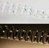 Two images of an LED strip light coiled in a spiral. The top image shows the LED strip unlit against a white background. The bottom image shows the LED strip lit with a warm white light against a dark background. Produktbild-Vorschau