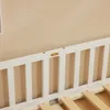 A close-up view of a white wooden bed frame with slatted sides and visible wooden slats for the mattress support. Náhľad obrázku produktu