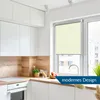 A modern kitchen with white cabinets, a wooden backsplash, and a window with a cream roller blind. Produktbild-Vorschau