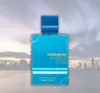 A bottle of perfume is shown against a blurred cityscape background. Náhled obrázku produktu