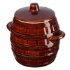 A brown ceramic pot with a lid and handles, isolated on a white background. Podgląd zdjęcia produktu