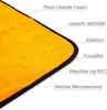 A close-up view of a corner of an orange microfiber towel with descriptive text labels. Produktbild-Vorschau