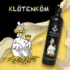 A bottle of Spitzmund Klötenköm Eierlikör is shown next to a cartoon chicken hatching from an egg, with splashes of cream in the background. Produktbild-Vorschau