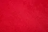 A close-up view of a red, textured fabric, likely a rug or carpet. Anteprima dell’immagine prodotto