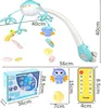 A product image showing a baby mobile with attached toys, a remote control, and packaging, along with various dimensions indicated by measurement lines and text. Náhľad obrázku produktu