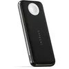 A black Satechi Quatro Wireless Power Bank with a white charging pad on top, shown at an angle against a white background. Produktbild-Vorschau