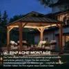 A wooden gazebo with string lights at night, furnished with outdoor seating. Produktbild-Vorschau