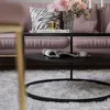 A stylish living room scene featuring a pink sofa, a coffee table with decor, and a fluffy rug. Produktbild-Vorschau