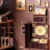 A collection of miniature astronomical models and decorative items displayed against a patterned wallpaper. Náhľad obrázku produktu