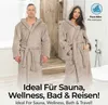 A man and a woman wearing hooded bathrobes in a bathroom setting. Produktbild-Vorschau