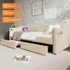 A beige upholstered daybed with two drawers pulled out, set against a floral wallpaper. Anteprima dell’immagine prodotto
