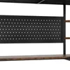 A close-up view of a black pegboard panel with white dots, mounted on a metal frame, above a wooden shelf. Podgląd zdjęcia produktu