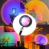 A collage of images showing a sunset lamp projecting colorful light onto walls and furniture in different room settings. Podgląd zdjęcia produktu