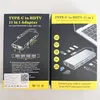 Two boxes of a USB-C hub adapter are shown side-by-side. Produktbild-Vorschau