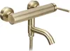 A close-up studio shot of a gold-colored bathroom faucet with a ribbed texture on the main body. Produktbild-Vorschau