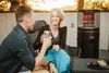 A couple enjoying drinks on a patio next to a patio heater. Produktbild-Vorschau