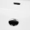 A close-up view of a white ceramic sink with chrome drain and overflow. Produktbild-Vorschau