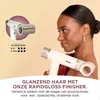A woman is holding a white hairdryer, with a close-up inset of the hairdryer's nozzle and settings. Voir les images du produit