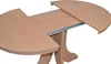 A close-up view of an extendable dining table with a light wood finish. Produktbild-Vorschau