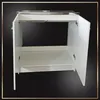 A white kitchen cabinet with a double sink and a stainless steel countertop, shown with its doors open. Produktbild-Vorschau