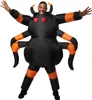A person wearing an inflatable spider costume. Produktbild-Vorschau