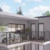 A balcony with a railing and outdoor furniture, set against a sky with clouds. Produktbild-Vorschau