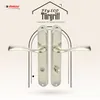 A marketing image showcasing two door handles against a patterned background with a house-like graphic and text. Produktbild-Vorschau