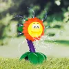 A toy sprinkler shaped like a flower is spraying water on a lawn. Náhled obrázku produktu