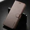 A brown leather flip case for a smartphone is shown on a dark, textured surface. Produktbild-Vorschau