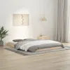 A bedroom scene with a bed, a plant, and a painting on the wall. Náhled obrázku produktu