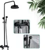 A black shower system with a rain shower head and a handheld shower head, shown in a main image and two close-up detail shots. The background includes blurred green foliage. Produktbild-Vorschau