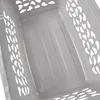 A close-up view of the interior of a gray plastic laundry basket with a patterned cutout design on the sides. Anteprima dell’immagine prodotto