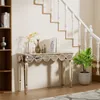 A mirrored console table with decorative items and a plant placed near a staircase. Produktbild-Vorschau