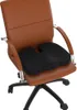 A black orthopedic seat cushion is placed on a brown leather office chair. Náhľad obrázku produktu