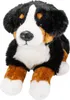 A plush toy dog, specifically a Bernese Mountain Dog, is shown lying down against a white background. Podgląd zdjęcia produktu