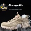 A close-up marketing image of a beige safety shoe with smoke effects emanating from it, suggesting breathability. Produktbild-Vorschau