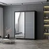 A modern bedroom with a large sliding door wardrobe with a mirrored front. Voir les images du produit