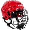 A red CCM hockey helmet with a black cage, shown from a front-diagonal angle against a white background. Náhľad obrázku produktu