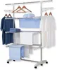 A multi-tiered drying rack with various laundry items on it, including clothes and towels. Produktbild-Vorschau