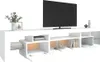 A white TV stand with a television on top and decorative items on the shelves. Náhled obrázku produktu