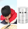 A child is shown making small food items, with a close-up of a metal tool next to it. Náhled obrázku produktu