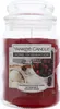 A Yankee Candle jar with a red candle and a label. Podgląd zdjęcia produktu