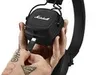 A person's hands are holding a black Marshall Major IV wireless Bluetooth headset, with a USB-C cable being plugged into the headset. Voir les images du produit