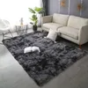 A shaggy rug in a living room setting with a sofa and a plant. Podgląd zdjęcia produktu