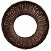 A top-down view of a brown wicker ring, likely a Christmas tree skirt or stand cover, against a white background. Produktbild-Vorschau