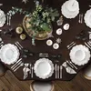 A beautifully set dining table with festive decorations, plates, cutlery, and glassware. Produktbild-Vorschau