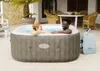 A couple relaxing in an inflatable hot tub on a patio. Produktbild-Vorschau