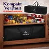 A storage bag for Christmas decorations is shown on a shelf with other Christmas items. Produktbild-Vorschau