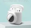 A white silicone case for AirPods and an AirTag is shown on a light blue background. Náhled obrázku produktu